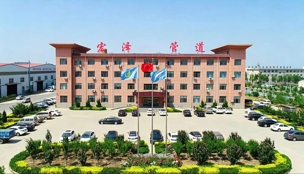 Headquarters and factory building of Zhengzhou Hongze Valve Pipeline Co., Ltd. showing industrial manufacturing facility and office environment